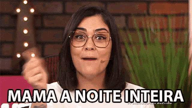 a woman wearing glasses is holding a knife and says mama a noite inteira in a foreign language .