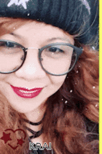 a close up of a woman wearing glasses and a black hat