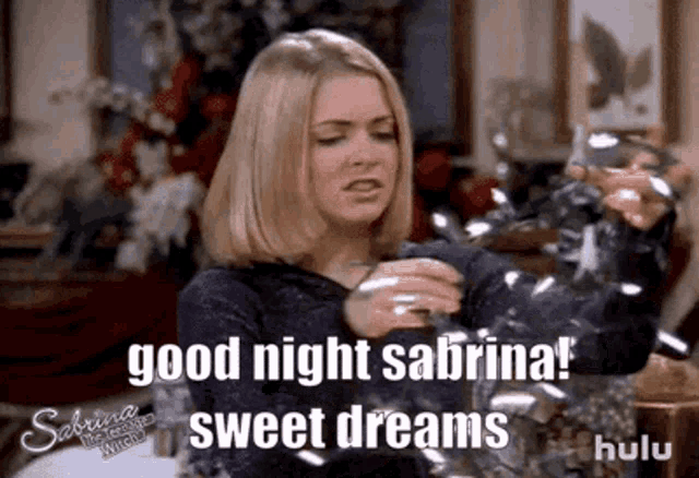 a woman is holding a glass and says `` good night sabrina ! sweet dreams `` .