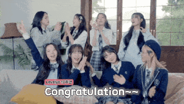 a group of girls in school uniforms are sitting on a couch with the words congratulation on the bottom