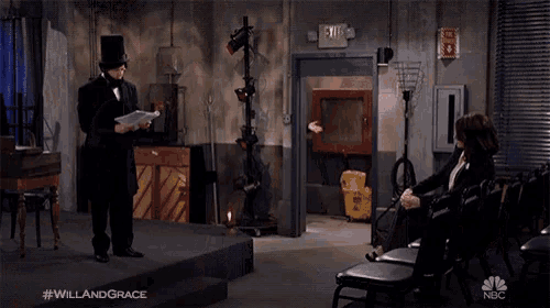 a man in a top hat is standing next to another man in a suit with the hashtag #willandgrace on the bottom