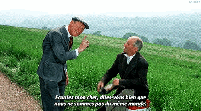 two men are standing in a grassy field and one of them says " ecoutez mon cher "