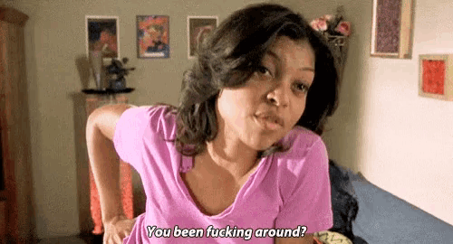 a woman in a pink shirt is sitting on a couch in a living room and says `` you been fucking around ? ''