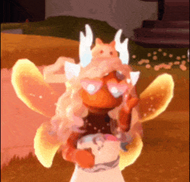 a girl with wings and a cat on her head is standing in a field .