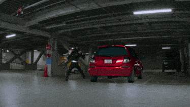 a red car that has a license plate that says ' a ' on it