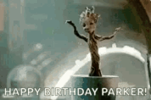 a statue of groot from guardians of the galaxy is dancing in a room .