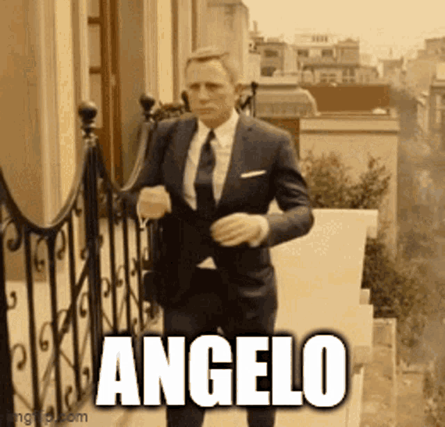 a man in a suit and tie is walking down a set of stairs and the word angelo is above him