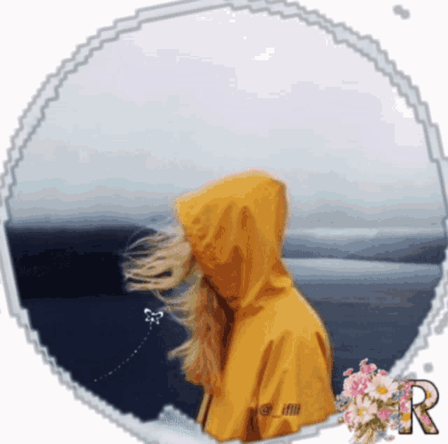 a woman in a yellow raincoat with the letter r on it
