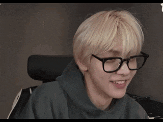 a person is sitting in front of a piano keyboard
