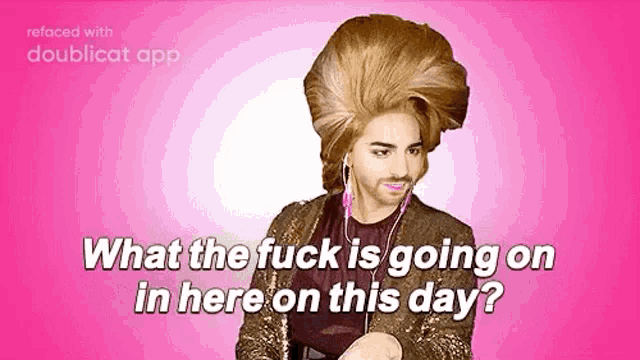 a man with a big hairdo and a beard is wearing headphones and a gold jacket .