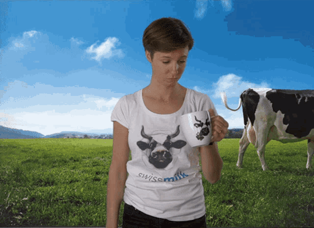 a woman in a swissmilk shirt holds a mug
