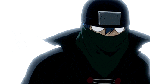 a man wearing a helmet and a green scarf around his face