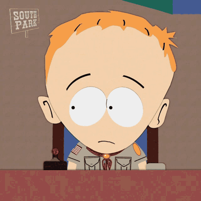 a cartoon character from south park sits in front of a sign that says south park