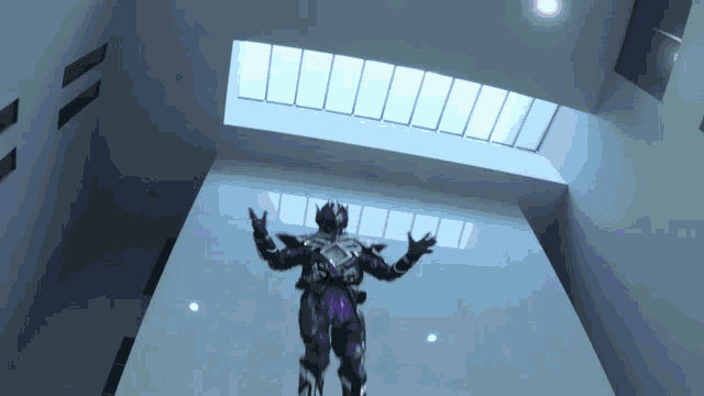 a person in a purple suit is standing in a room with a skylight above them