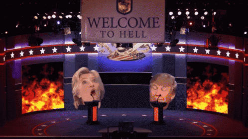 a welcome to hell sign hangs above a podium