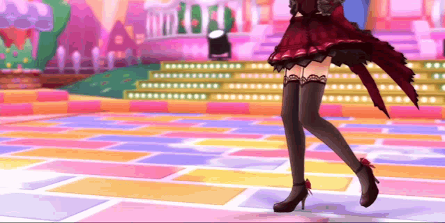 a woman in a red dress is dancing on a colorful dance floor