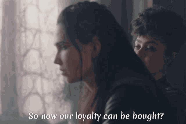 two women are looking out a window with the words so now our loyalty can be bought