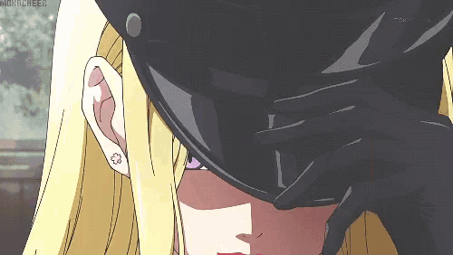 a close up of a person covering their face with their hand