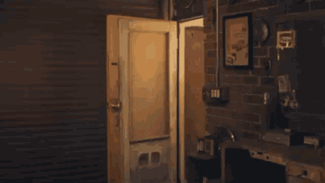 a woman is standing in a doorway holding a gun