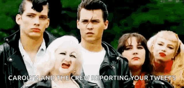 a group of people are standing next to each other and a woman is screaming .