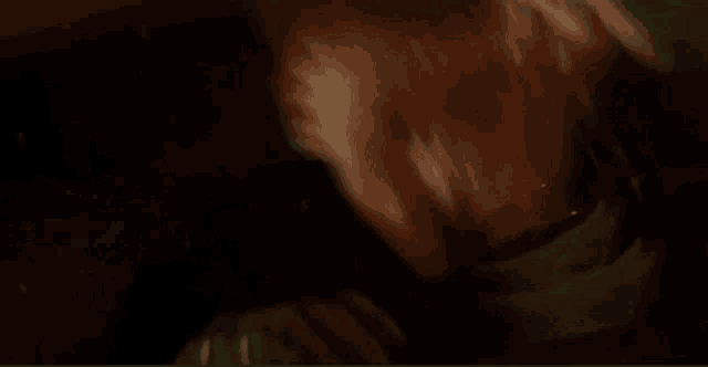 a close up of a person 's face with blood coming out of it