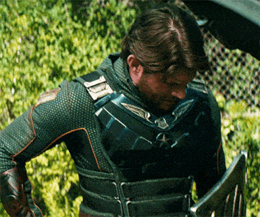 a man with a beard is wearing a green suit with a star on it