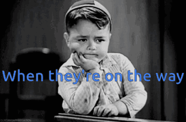 a black and white photo of a little boy with the words when they 're on the way above him