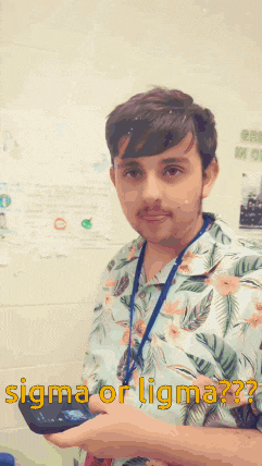 a man in a floral shirt is holding a cell phone and says sigma or ligma on the bottom