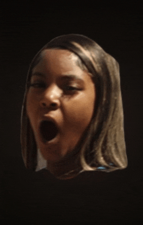 a close up of a woman making a face with her mouth open