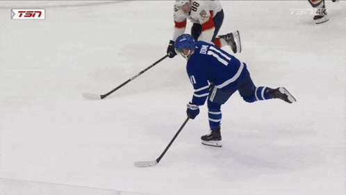 a hockey goalie is kneeling on the ice in front of a banner that says lg