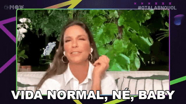 a woman wearing headphones says vida normal