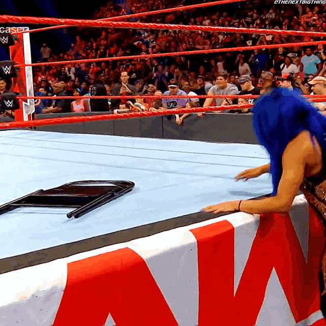 a woman in a wrestling ring with the word caser on the corner