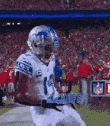 a football player is running down the field during a game