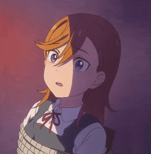 a girl is tied up with a rope and looks surprised