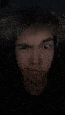 a close up of a person 's face with their eyes closed