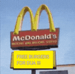 a mcdonald 's sign with a yellow sign below it that says free burgers for dua