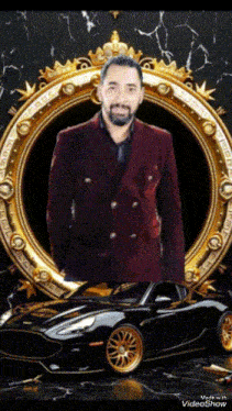 a man in a red suit stands in front of a black car