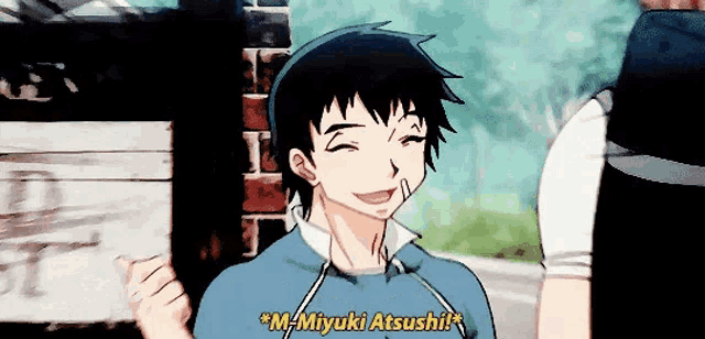 a man in a blue sweatshirt is smiling and says " m-miyuki atsushi "