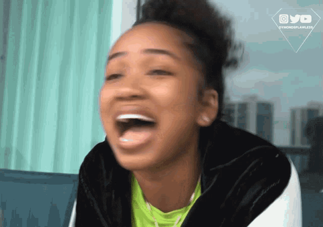 a woman is laughing with a watermark that says ovo on it