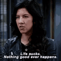 a woman is talking about life sucks . nothing good ever happens .