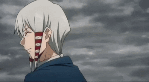 a man with white hair is wearing a mask and standing in front of a cloudy sky .