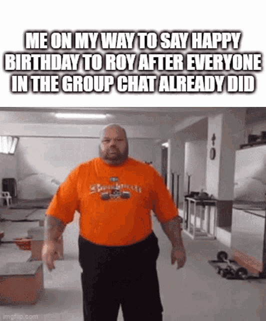 a man in an orange shirt is standing in a gym and saying happy birthday to roy after everyone in the group chat already did