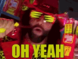 a man wearing sunglasses and a red hat is holding a bag of chips and says " oh yeah "