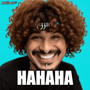 a man with curly hair and a nose ring is laughing with the word hahaha written on his face .