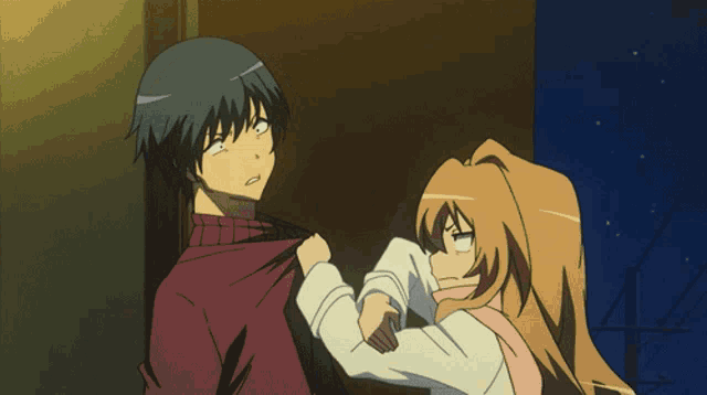 a boy and a girl standing next to each other