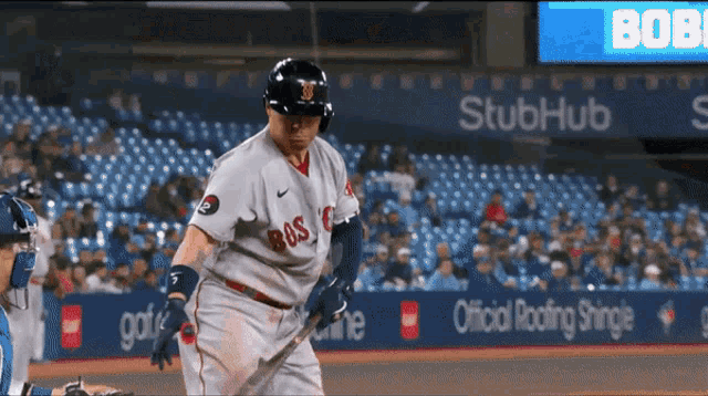 a baseball player wearing a jersey that says boston