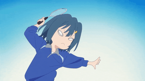 a girl in a blue jacket is holding a tennis racket