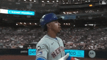 a baseball player with the number 24 on his jersey is standing on the field