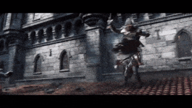 a man riding a horse in front of a brick wall