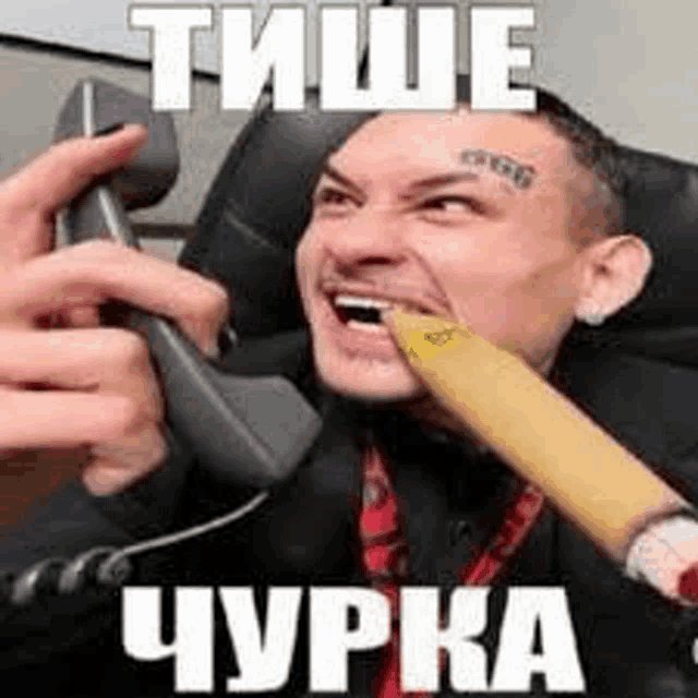 a man is talking on a cell phone with a banana in his mouth .